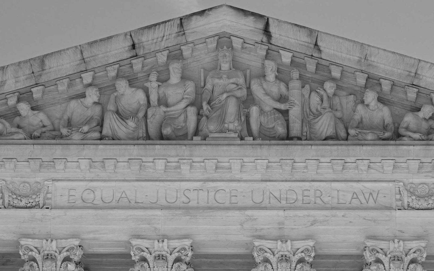 sculptures carved into a marble building